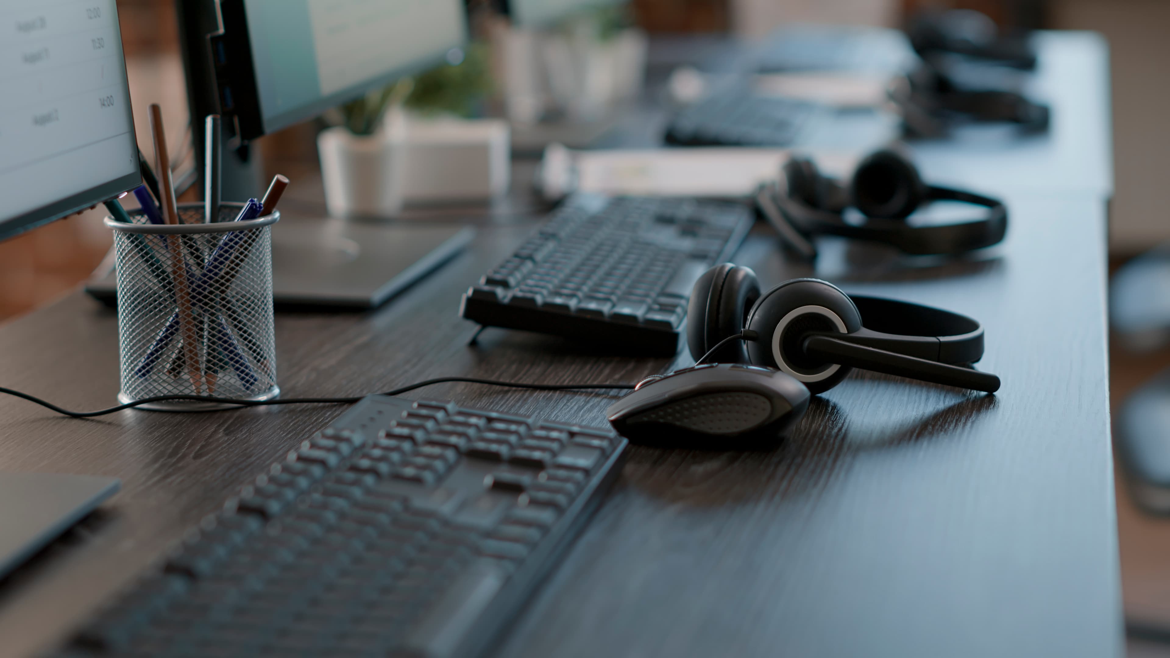 Dispatch floor with headsets and workstations—professional call handling for cab and limo operators