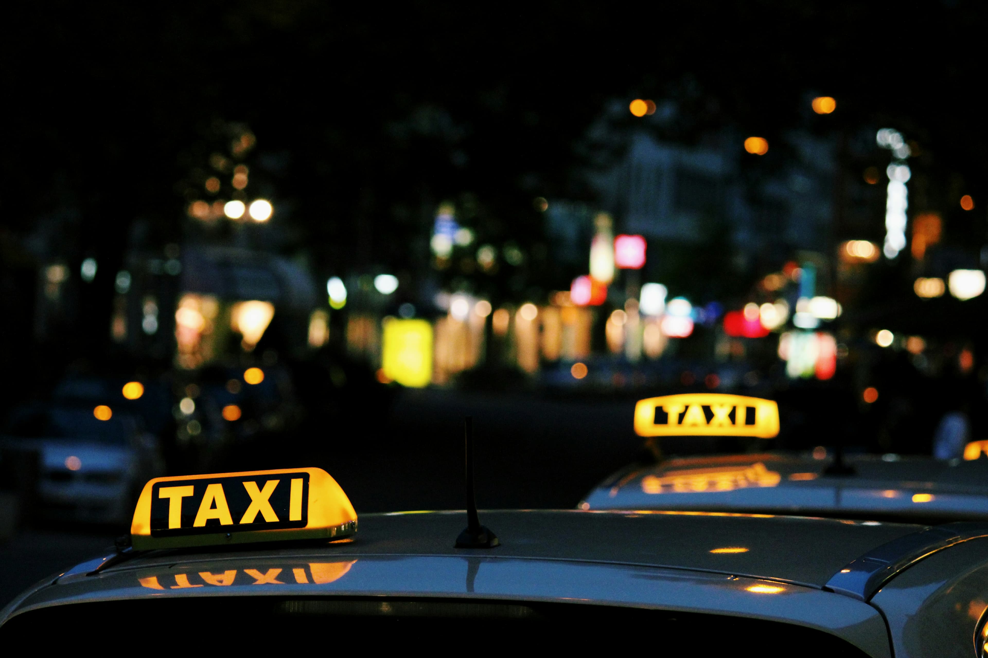 Taxi roof signs at night—urban cab operations your dispatch team supports